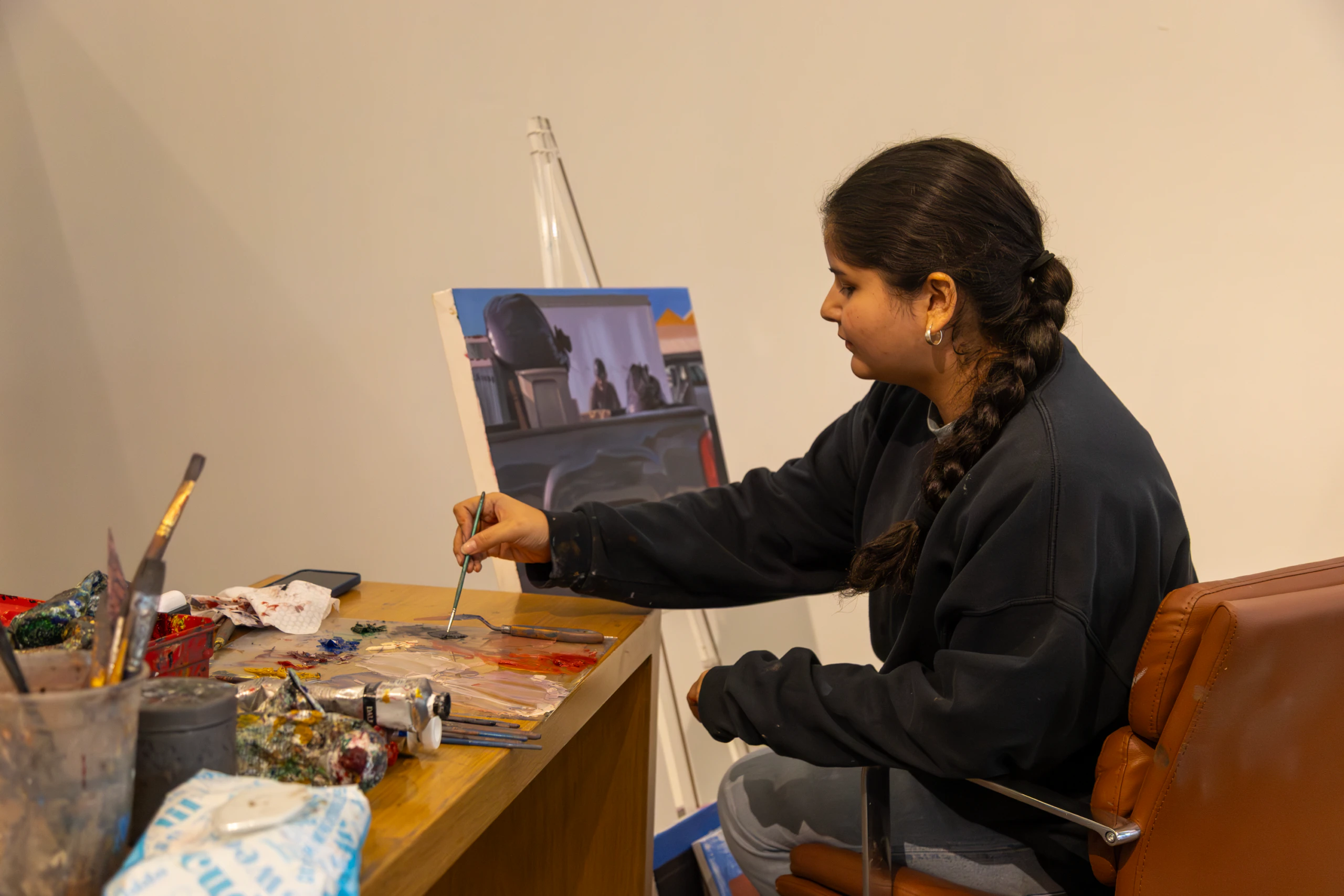 Teaching artist, Marie Franco, painting.