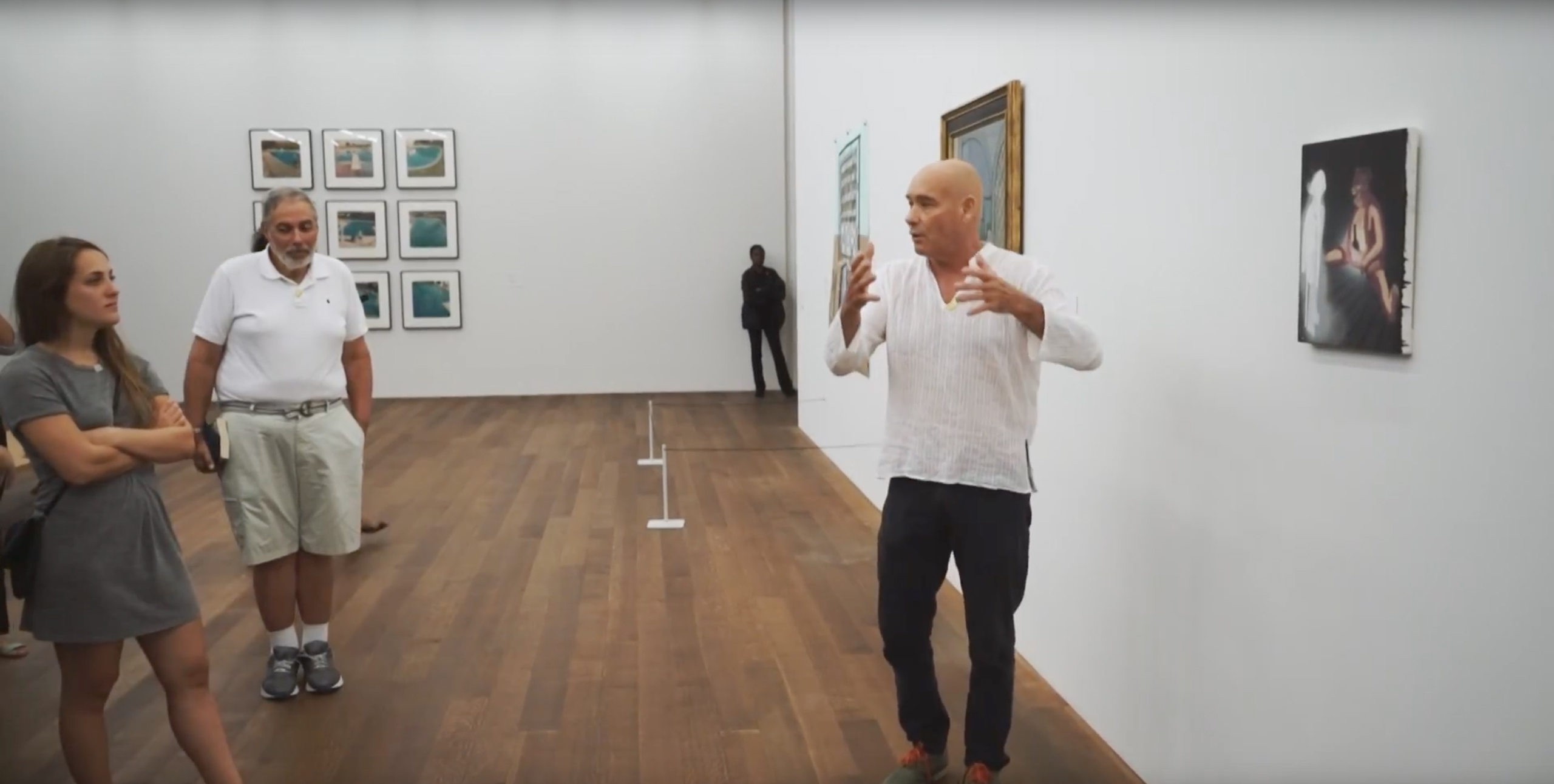 Group having a conversation next to art installation